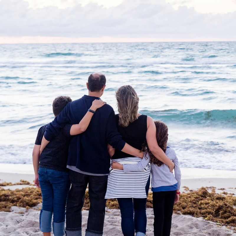 family at beach Wallet with credit cards